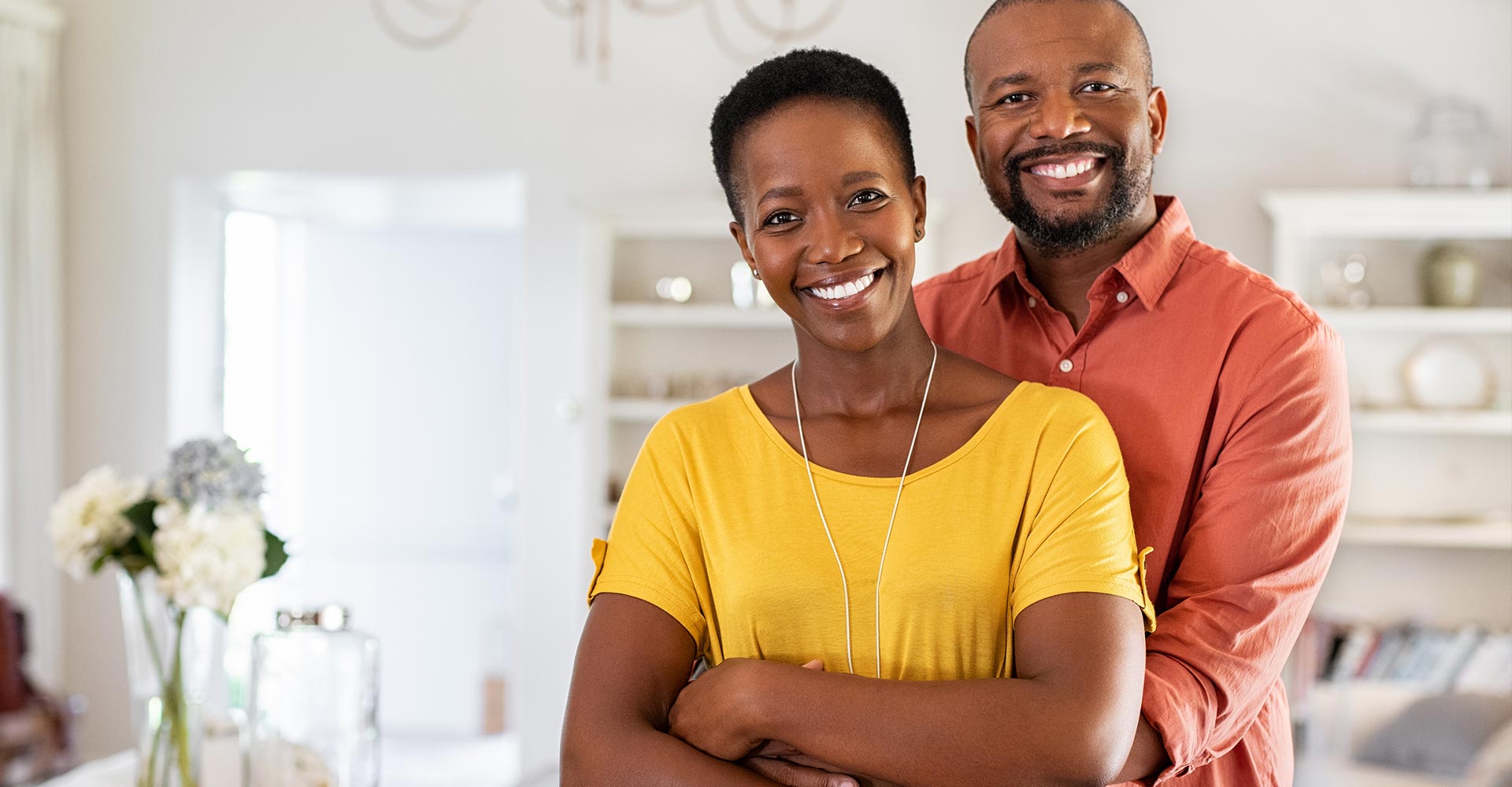 Mature black couple hugging and smiling