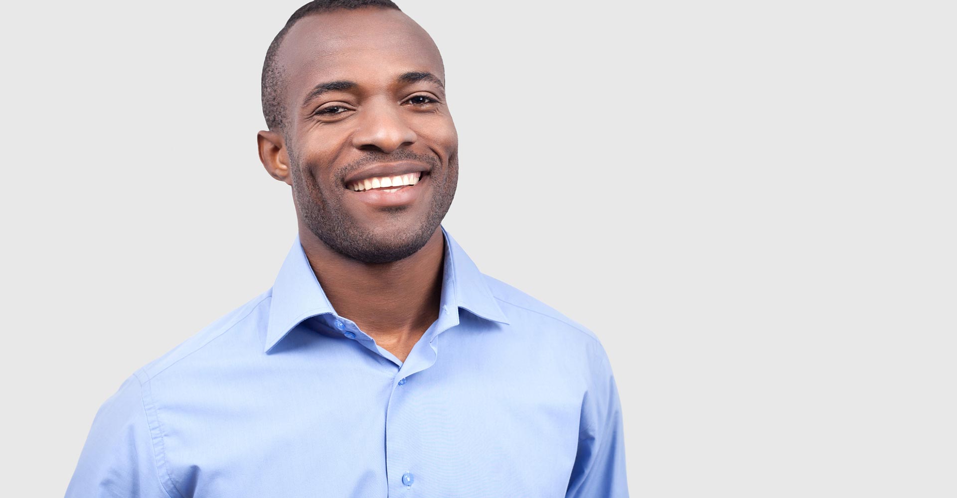 Young black man smiling at camera